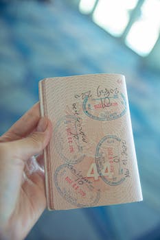 Person Holding an Opened Passport